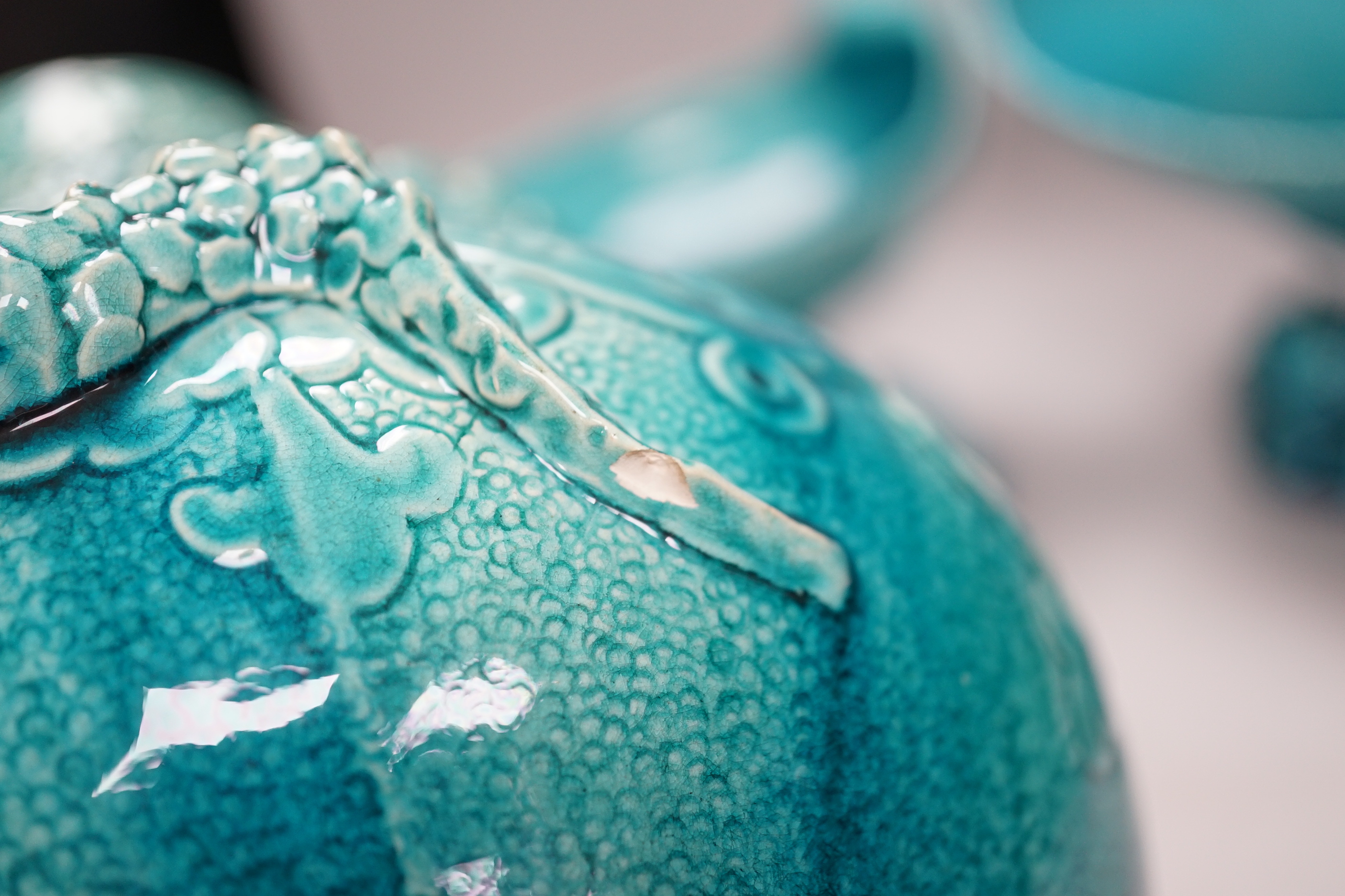 A pair of Burmantofts ‘dolphin’ pedestal bowls and a similar ‘dragon’ vase, 30cm